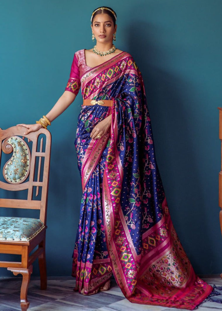 Fusion banarasi patola silk royal blue saree with pink paithani border and pallu, traditional design with intricate motifs ideal for wedding function look.