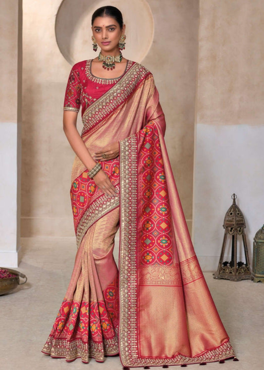 Peach color handwork embroidery patola silk saree online shopping with contrast red blouse and border.