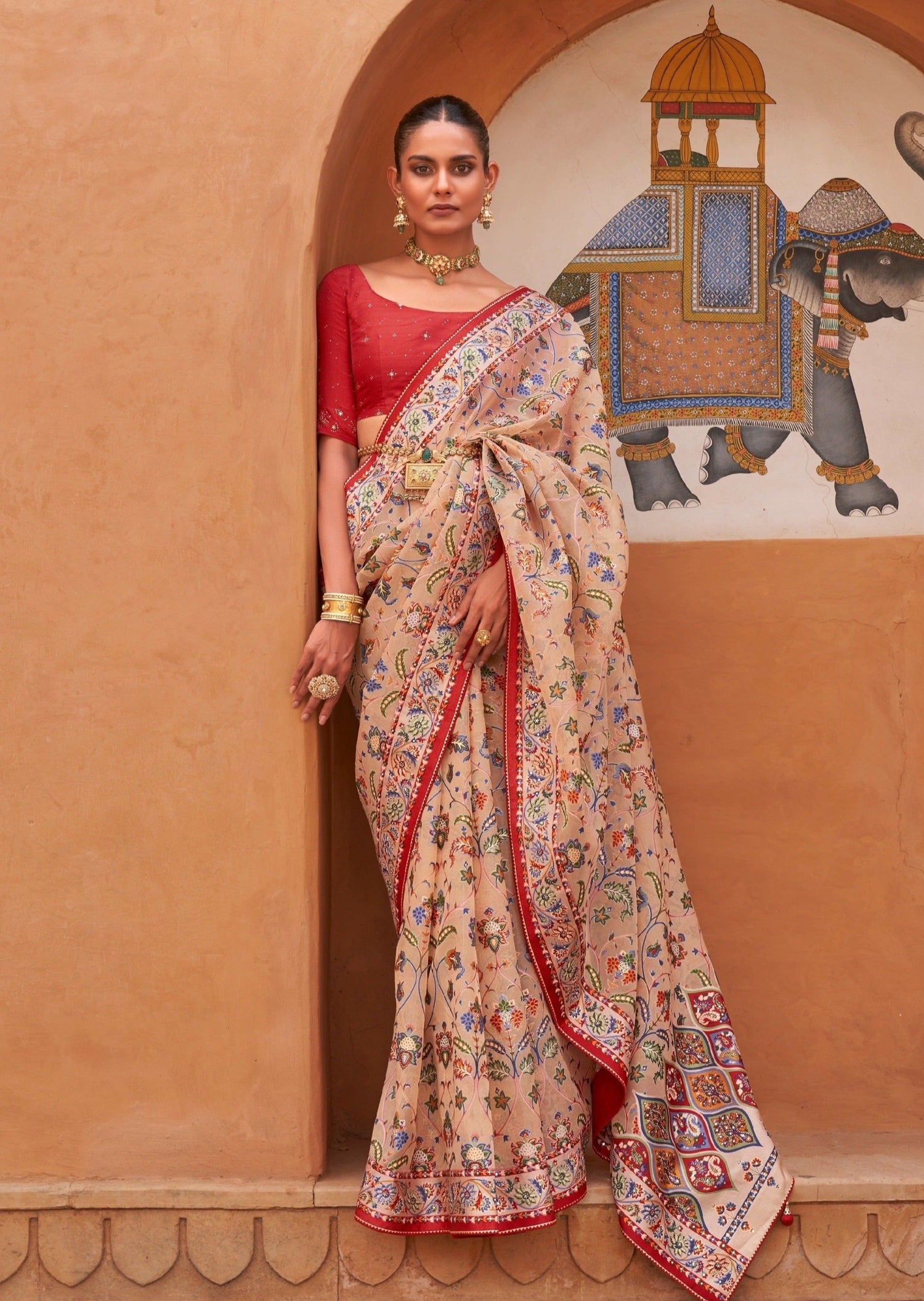 peach-tissue-saree-with-red-blouse