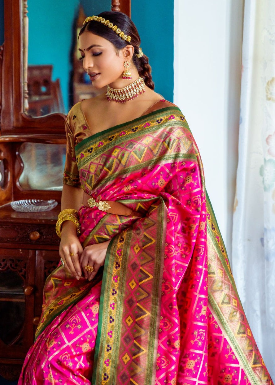 Hot pink banarasi patola handloom silk saree online with contrast golden blouse.