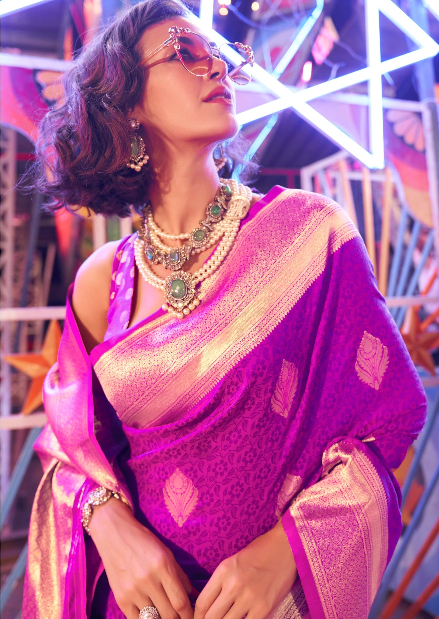 Pink banarasi silk saree with golden border.