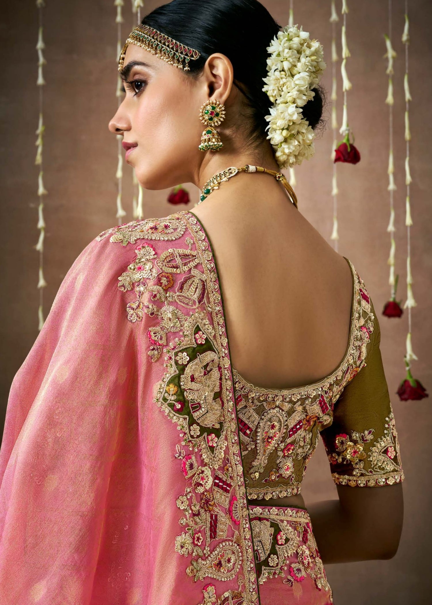 Banarasi tissue silk hand embroidery work pink saree online with contrast mehendi green blouse for reception look.