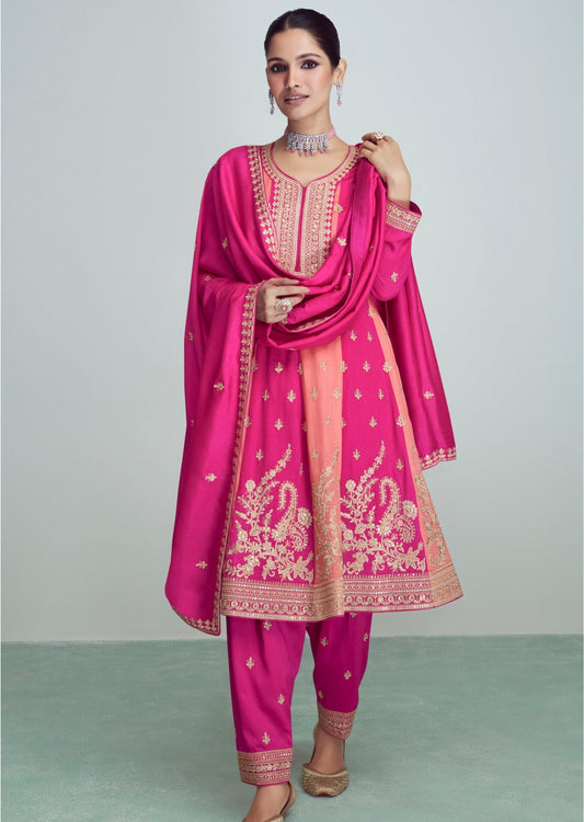 Woman in pink silk bridal salwar suit