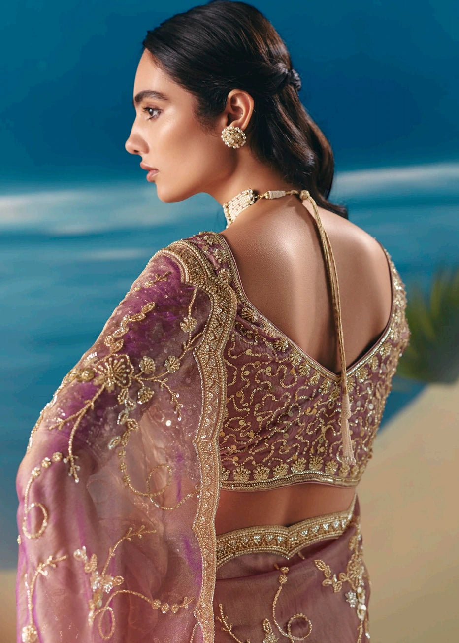 Designer pastel pink organza tissue bridal saree with deep cut blouse back design featuring sequins and beadwork hand embroidery for haldi and cocktail party. 