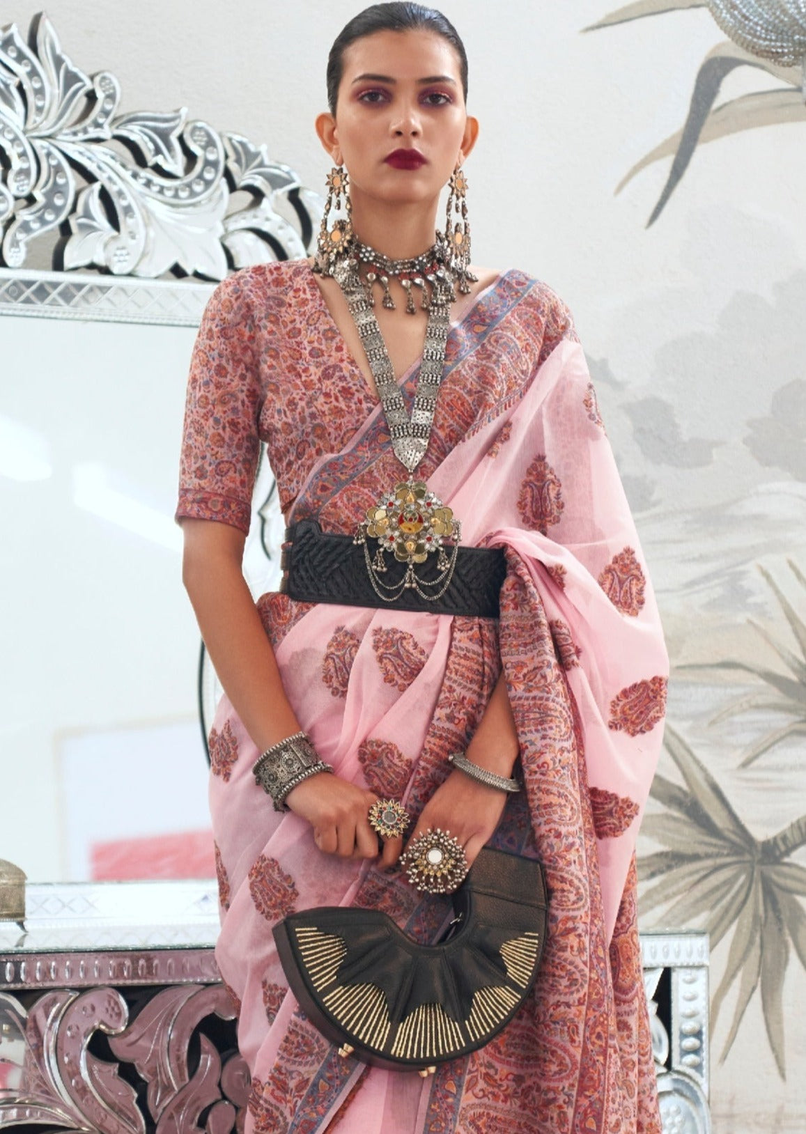 Kashmiri bride in handloom kashmiri silk bridal saree in pink color.