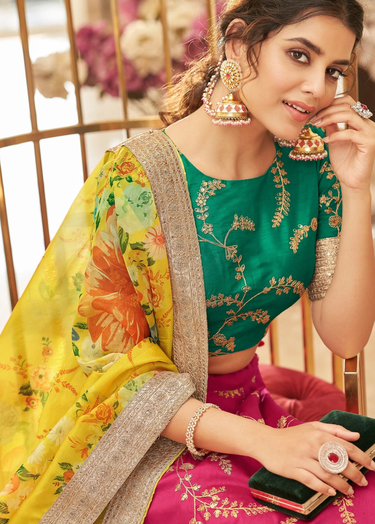 Yellow organza dupatta with coral and marigold digital floral print and gota lace border, emerald green raw silk blouse piece with sequins embroidery work, pink silk lehenga panel with gota patti, designer 3 piece haldi outfit set for brides and bridesmaids, Gen Z wedding fashion in Mauritius online.