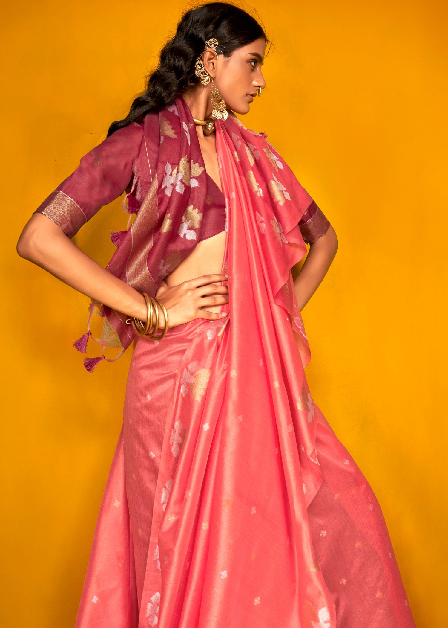 Luxurious handwoven rose pink tussar silk saree with rich maroon undertones, ideal for special events.