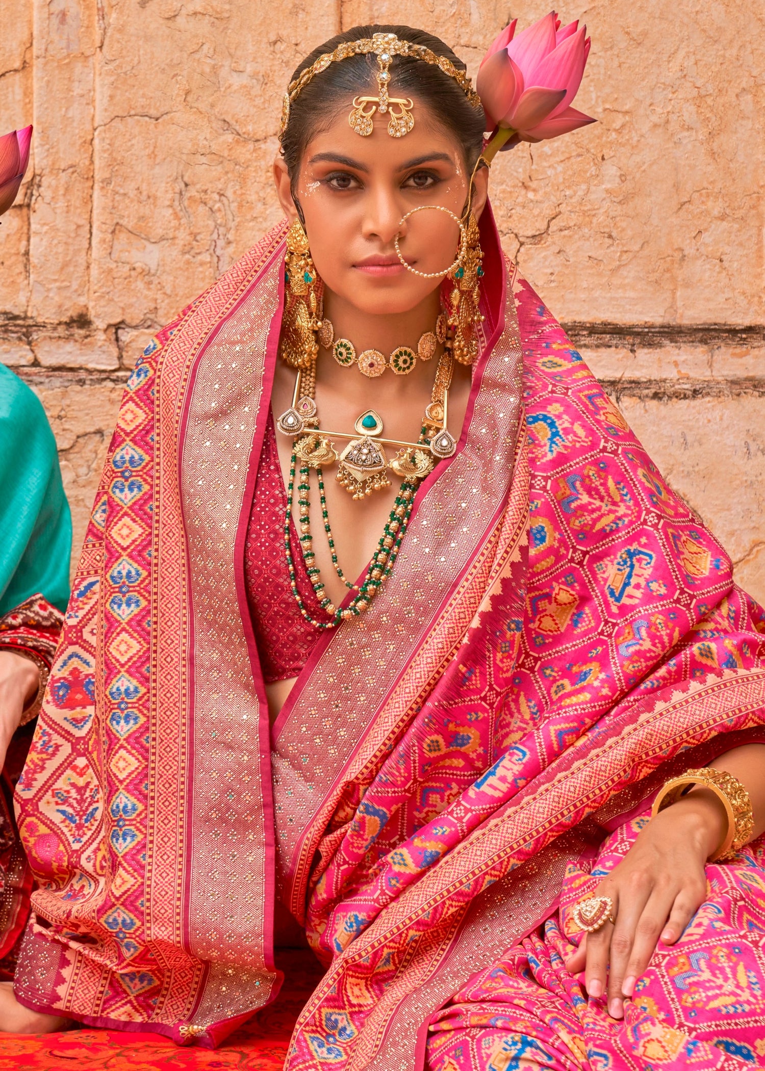 Pink patola silk saree online usa for indian wedding in traditional hathi popat design.