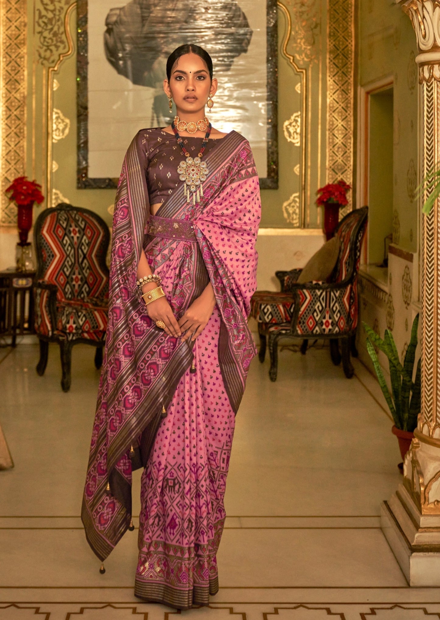 Woman in pink Patola saree