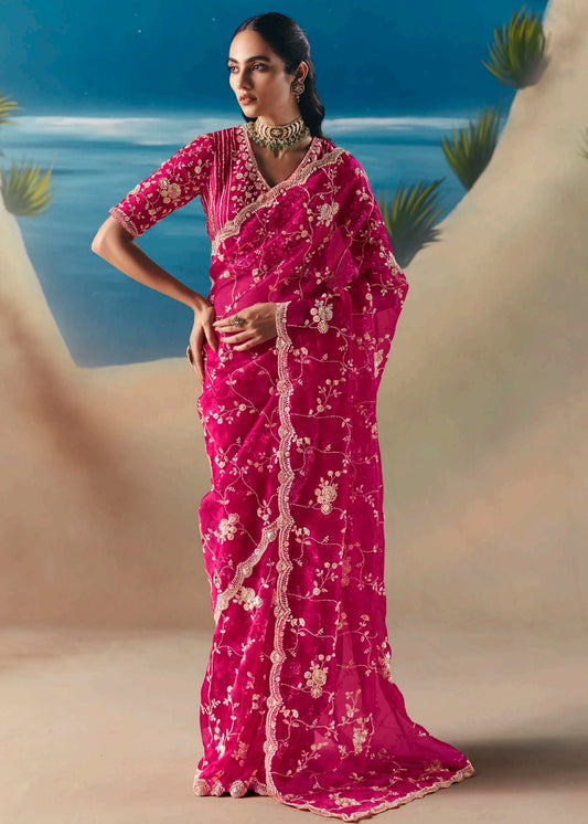 Pinkish red organza tissue silk hand embroidered sheer bridal saree with beadwork and sequins embroidery for wedding, reception or engagement look.