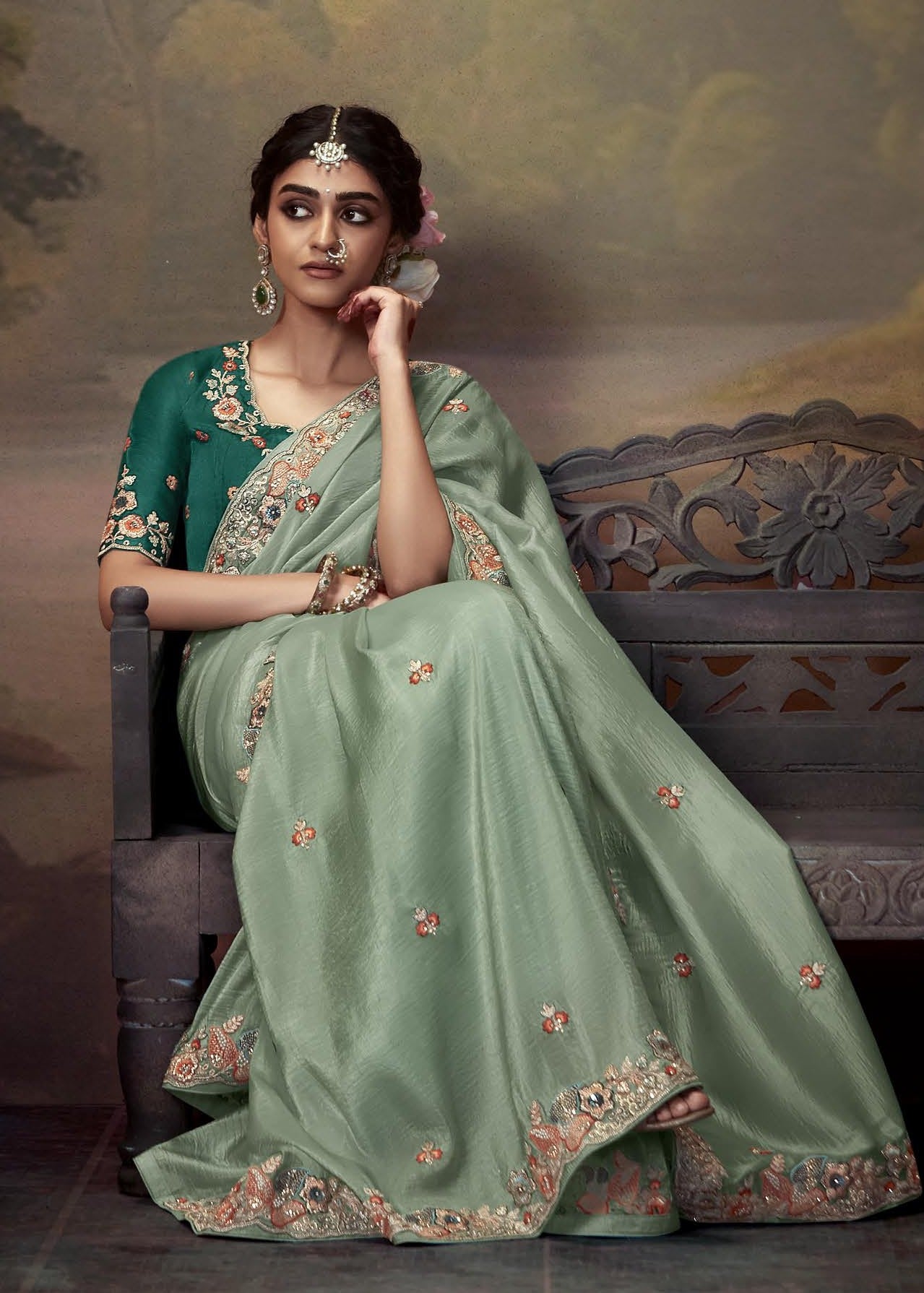 Exclusive pista green crushed tissue silk saree with elegant handwork embroidery and a dark green blouse piece for wedding ceremony.