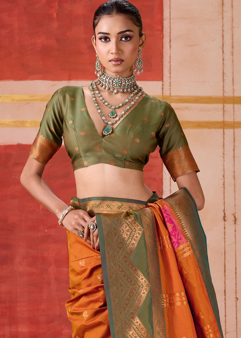 Pochampally Patola Silk Saree in vibrant orange with Mehendi Green Ikkat border and blouse, showcasing exquisite Indian handwoven craftsmanship, perfect for weddings, festivals, and special occasions.