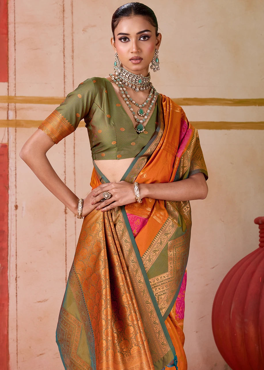 Traditional Pochampally Patola Silk Saree in vibrant orange, featuring intricate Mehendi Green Ikkat border and blouse, showcasing India's rich handloom heritage, perfect for weddings and festivals.