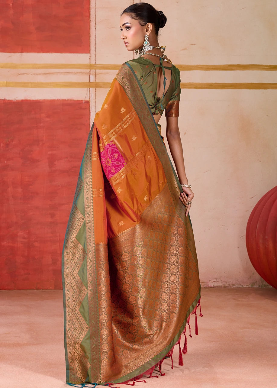 Orange Ikkat Pochampally Patola Silk Saree with intricate Mehendi Green border and blouse, exemplifying traditional Indian handloom artistry, ideal for weddings and festive occasions.