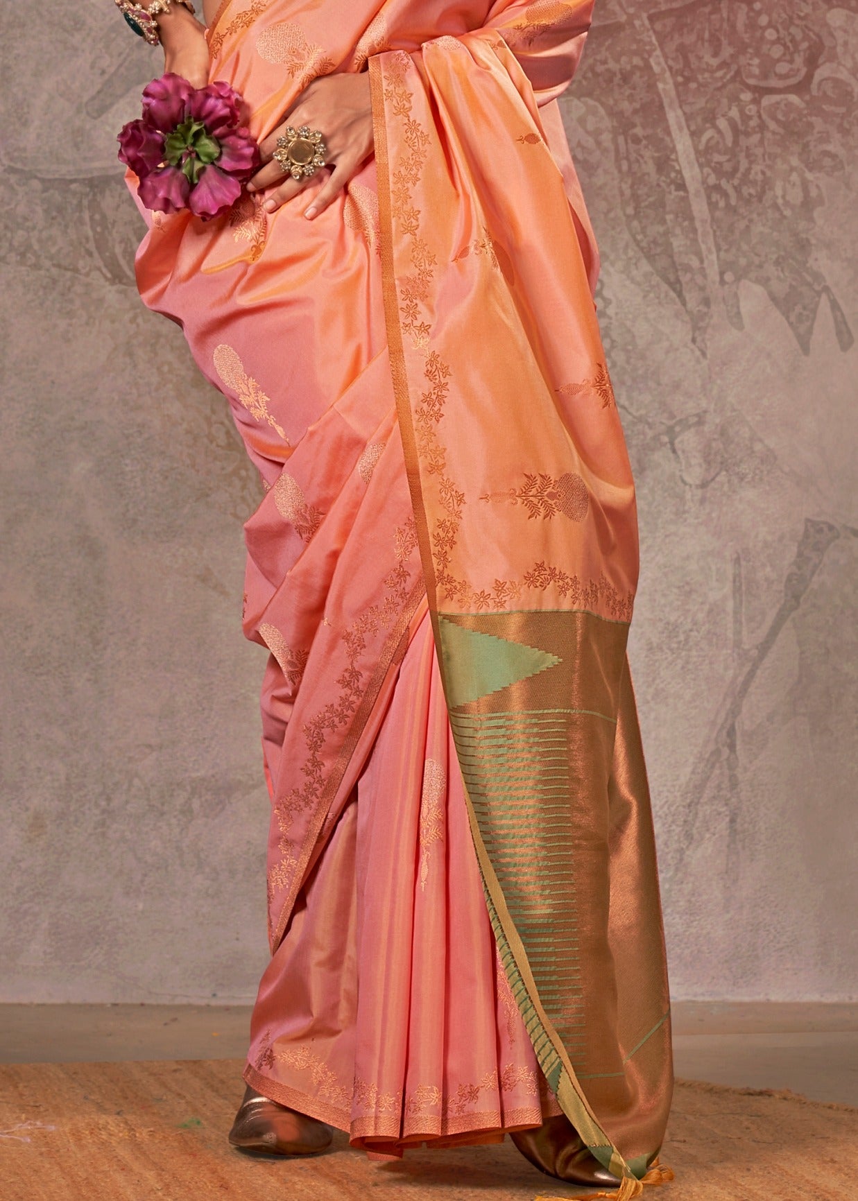 Premium handloom banarasi silk peach saree online with intricate designs and a contrasting green blouse for a timeless style.