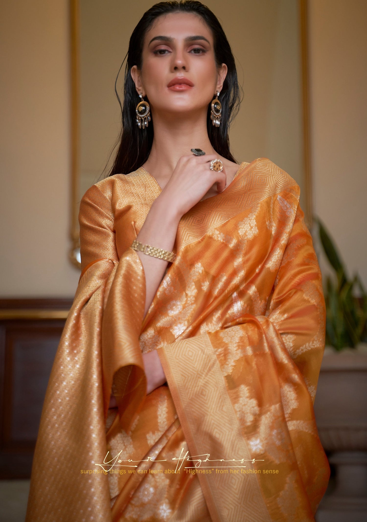 woman in open hair in orange organza saree in zari banarasi handloom weaving