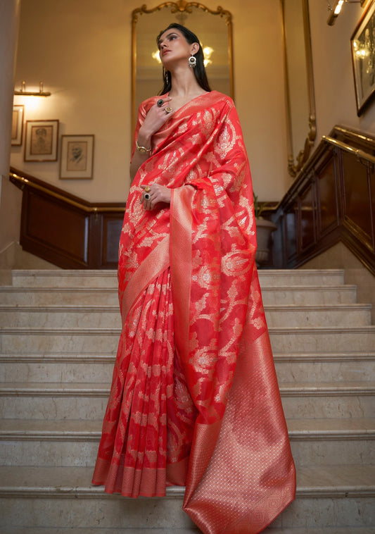 woman standing on white marble stairs wearing red colour Pure Banarasi Organza Zari Handloom Saree