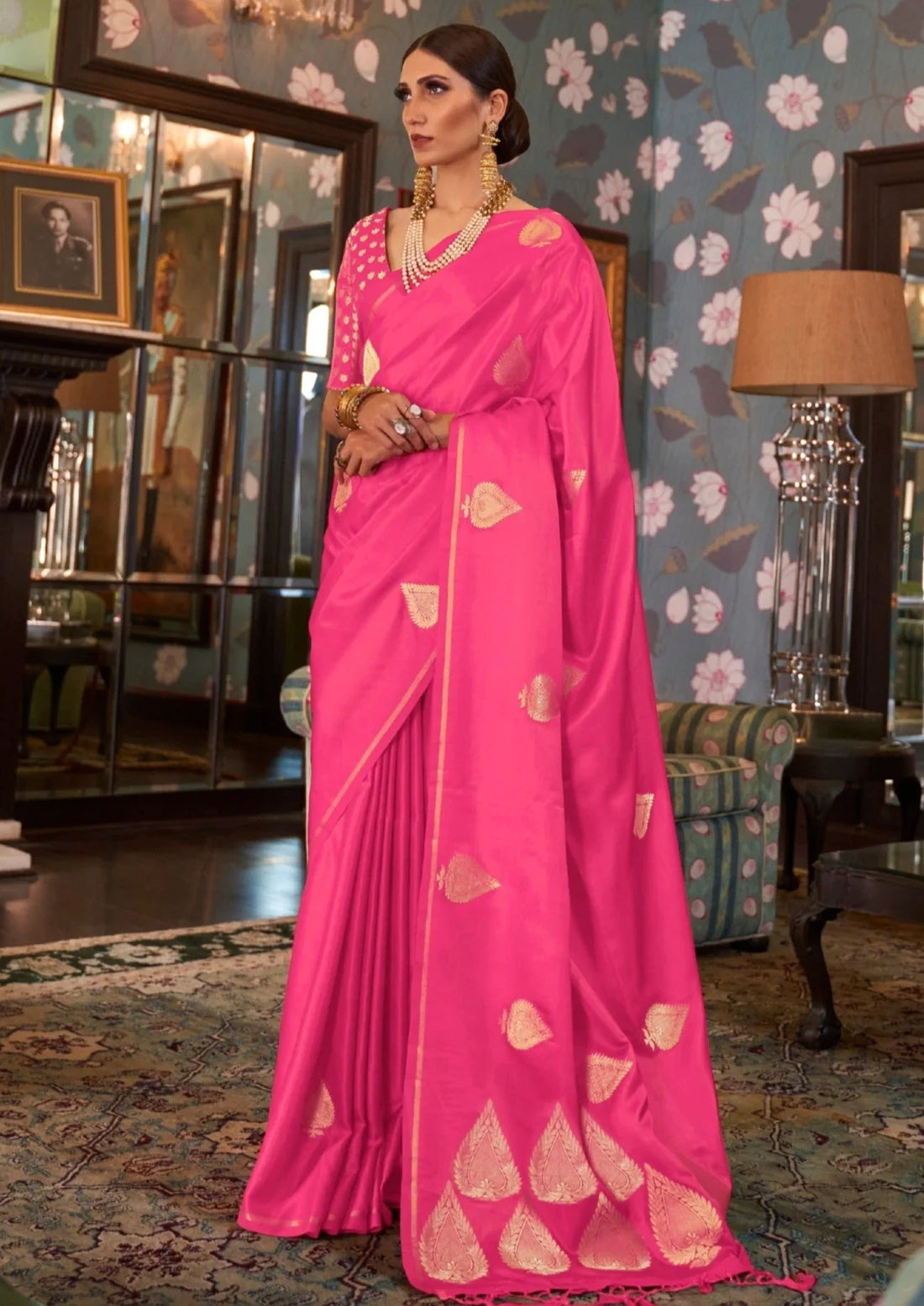 Woman in pure banarasi satin silk hot pink handloom saree blouse.