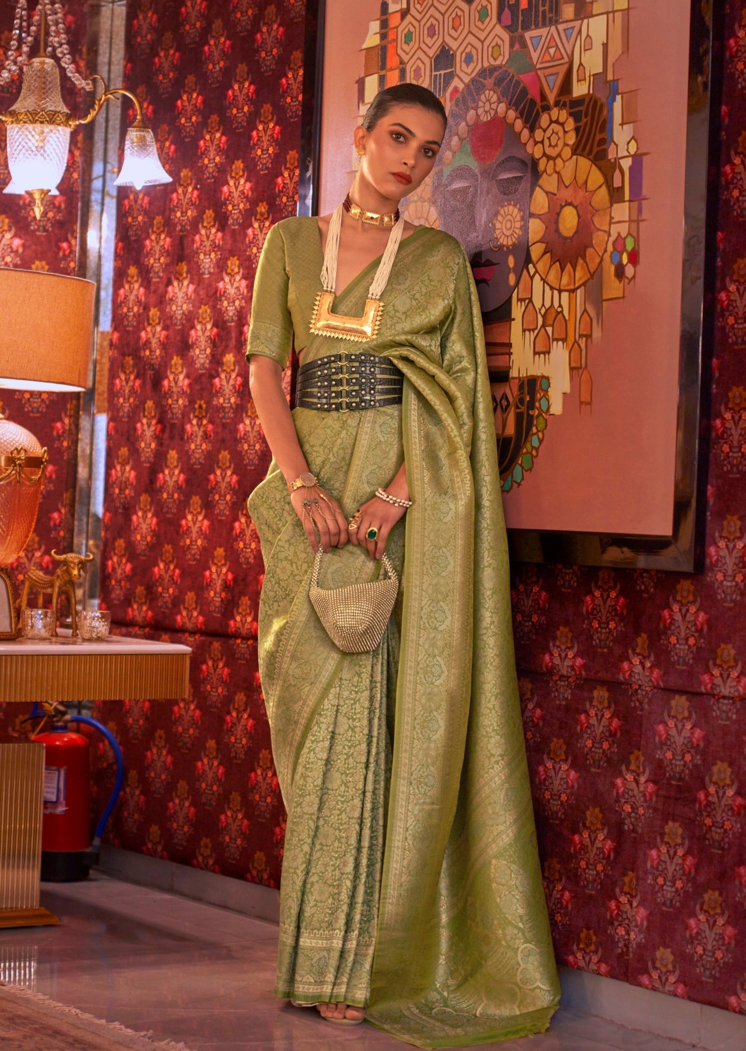 Woman standing in Pure Banarasi Silk Parrot Green color Handloom Bridal Saree