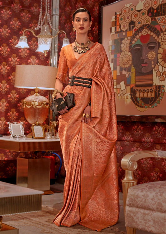 woman standing in Banarasi Silk yellow Handloom Bridal Saree in front of a white & gold table lamp