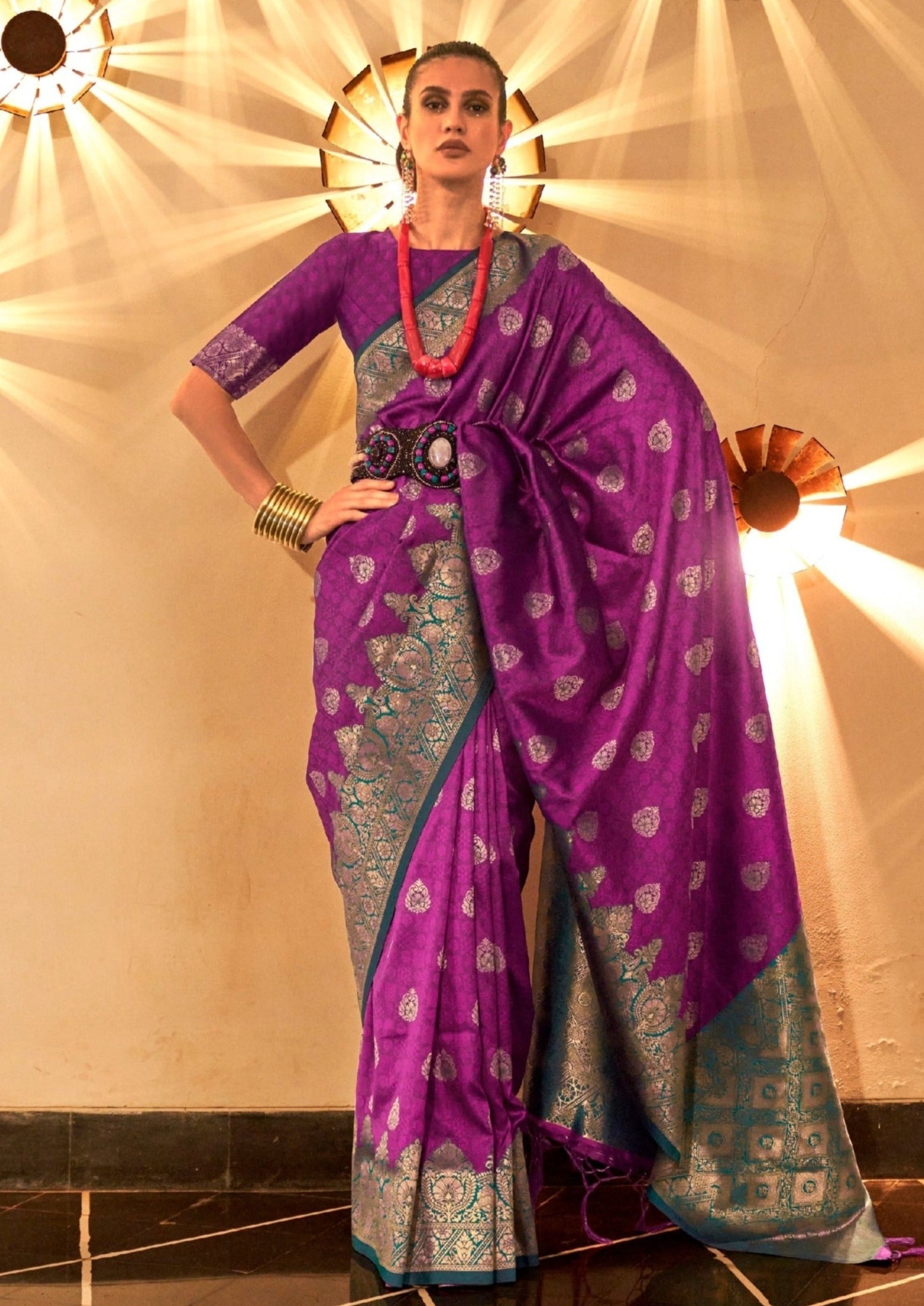 Woman standing in magenta pink colour Handloom silk saree