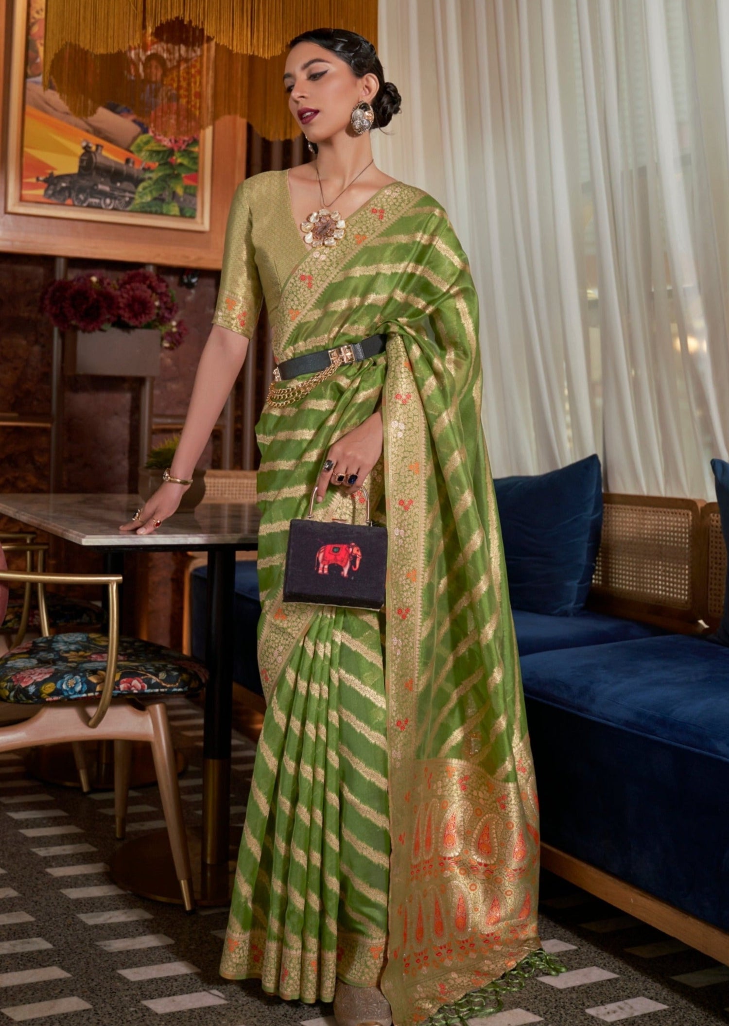 woman standing in Pure Handloom Banarasi Organza Green Saree with meenakari & jewelry