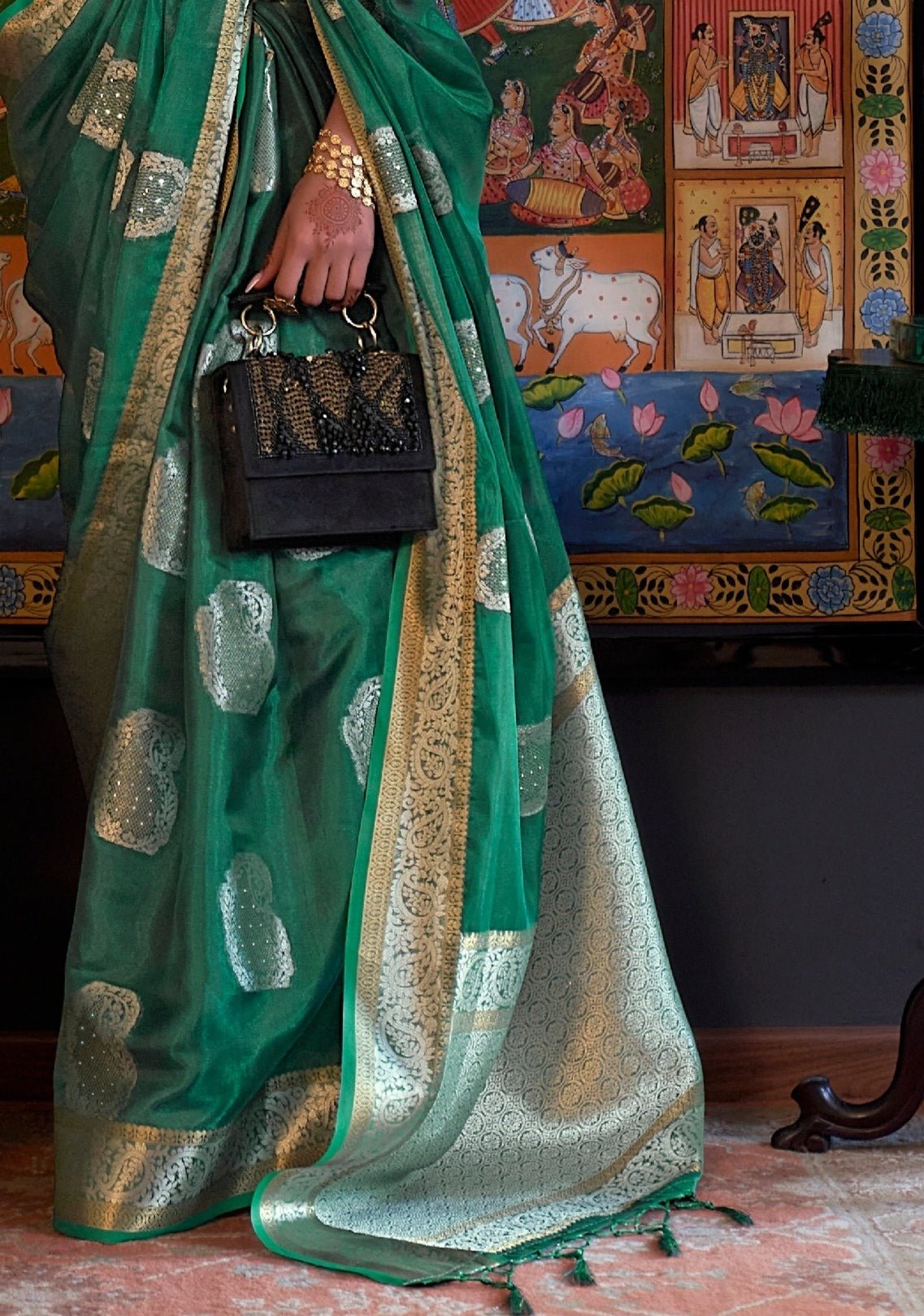 Pure handloom banarasi organza saree zari work pallu design in dark green colour.