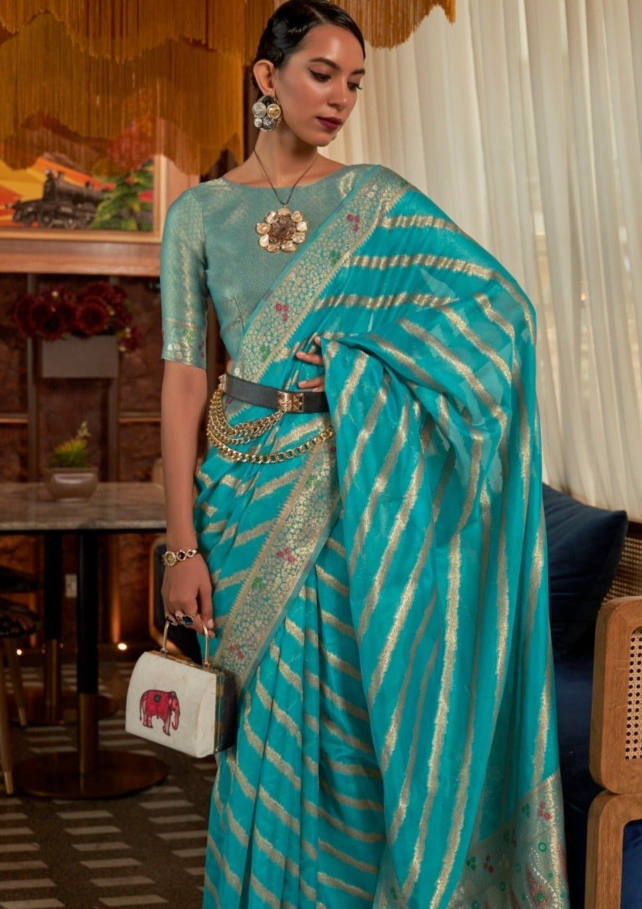 Pure handloom banarasi organza turquoise blue saree online shopping meenakari pallu design.