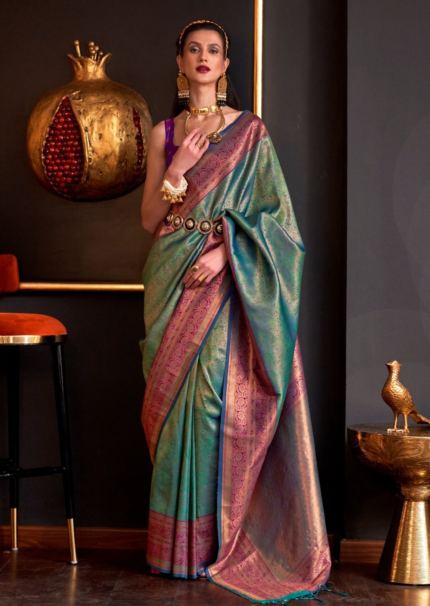 Pure handloom green kanjivaram silk saree with contrast blouse.