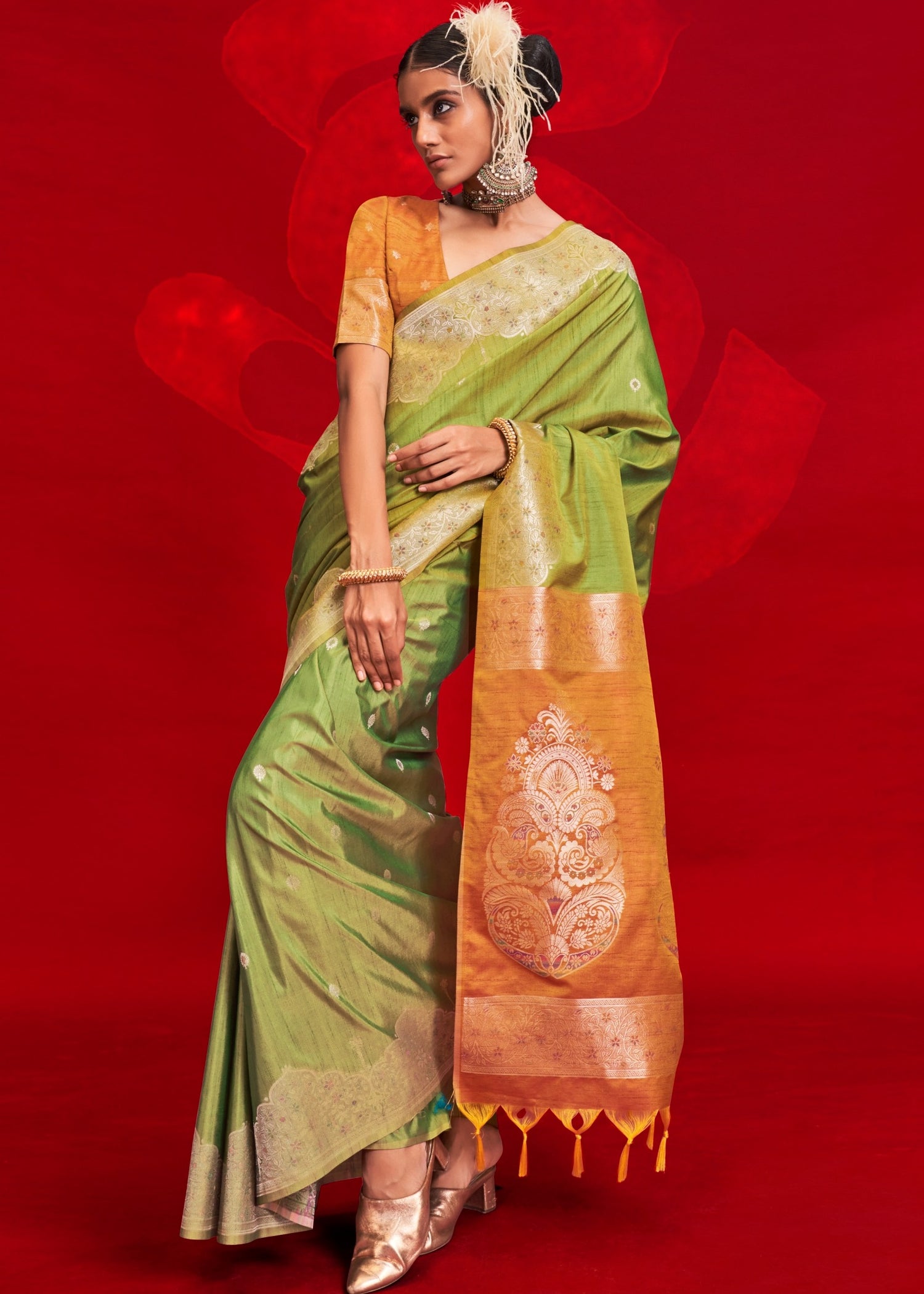 Elegant pure handloom tussar silk green saree with contrasting bright orange blouse for weddings and festivals.