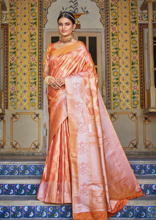 Woman standing in peach Kanchipuram silk saree on stairs