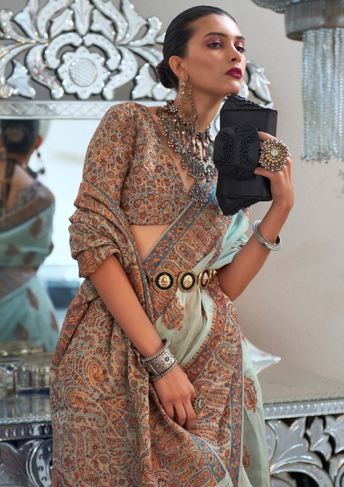 Kashmiri bride in handloom kashmiri silk light blue saree blouse.