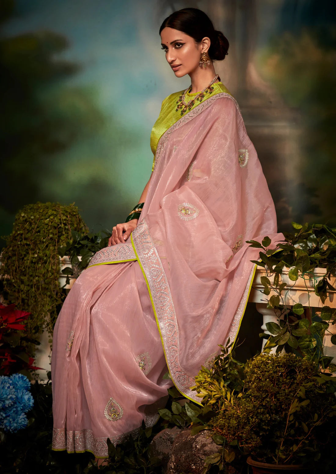 Woman in pink pure organza hand embroidery saree with yellow blouse.