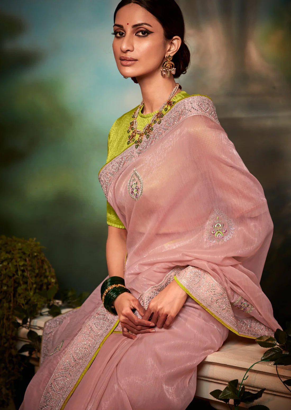 Pink organza saree with yellow blouse.
