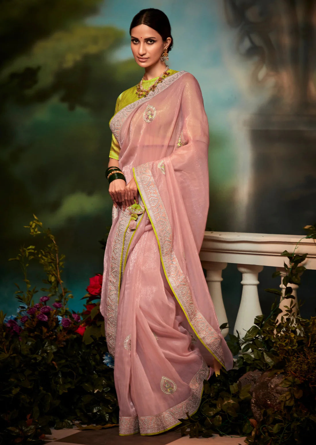 Bride in pink pure organza hand embroidery work saree with yellow blouse.