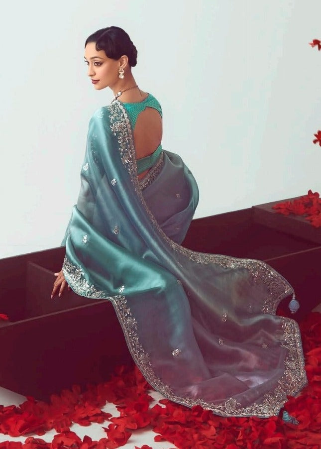 Indian origin pure organza tissue silk saree design with floral embroidery in multicolor blue shade for party wear look.
