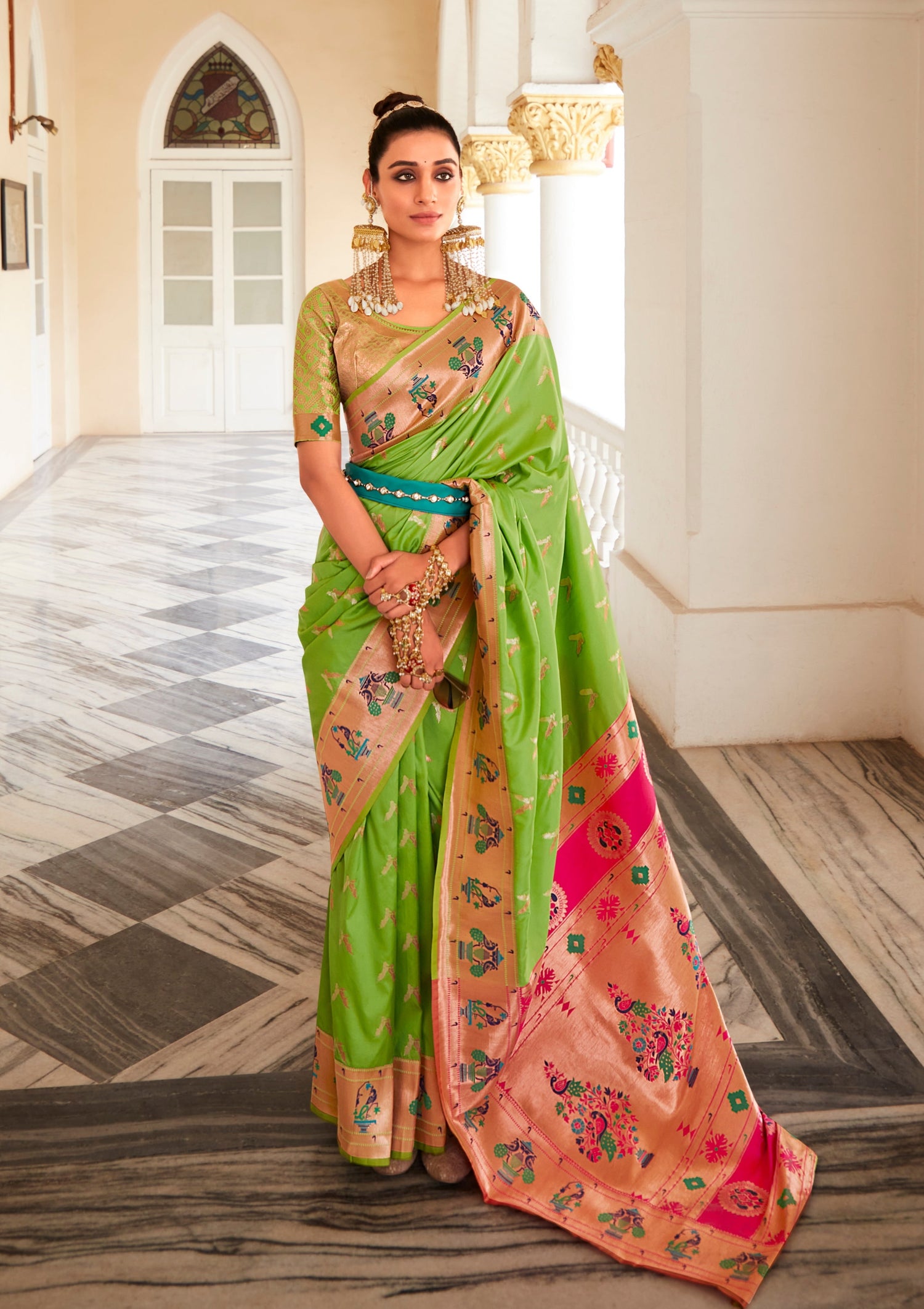 woman standing in Pure Paithani Silk green Bridal Saree