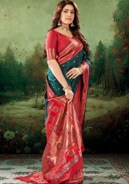 Woman in dark green Paithani saree with contrast red blouse.