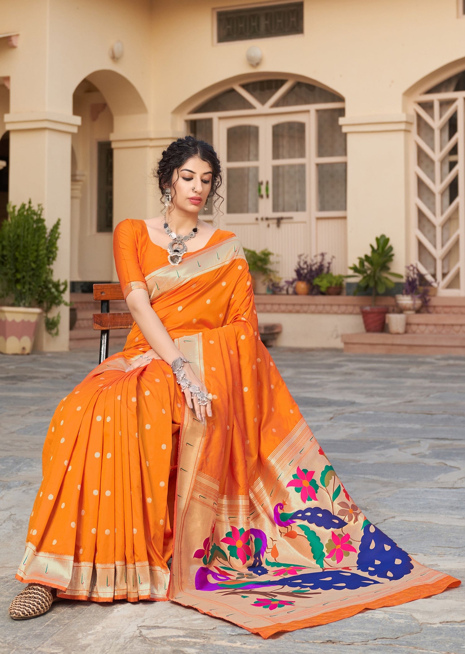 Pure paithani silk saffron orange handloom saree.