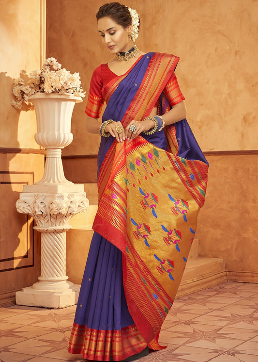 Purple paithani silk saree look with contrast red blouse online shopping in traditional Maharashtrian design.