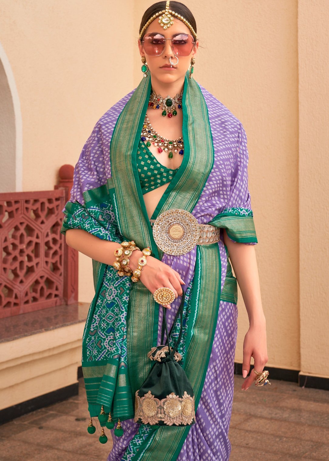 Purple patola silk saree with contrast green blouse online shopping.