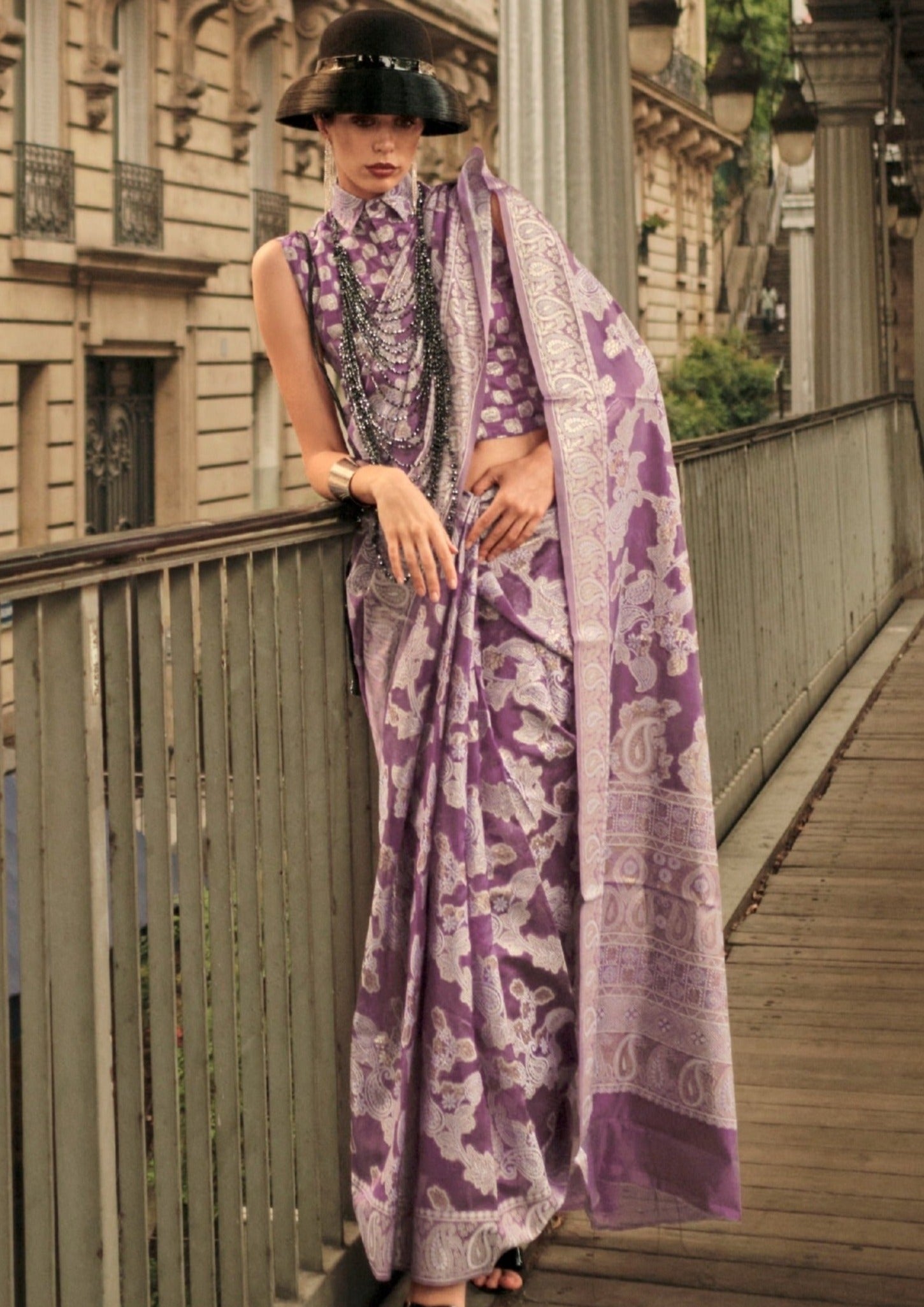 Woman in purple color organza lucknowi chikankari saree blouse.