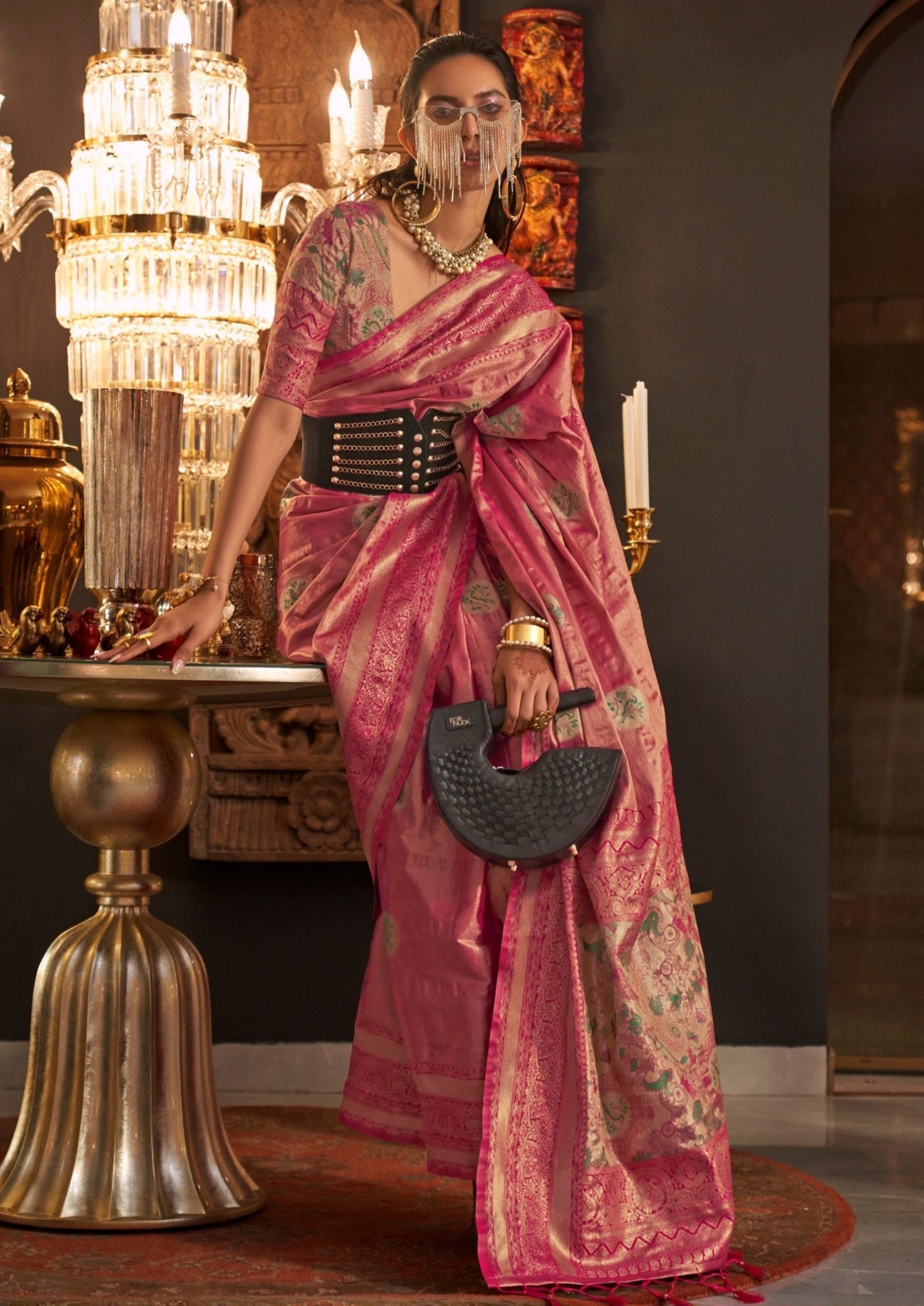 Woman in rani pink pure banarasi silk handloom saree blouse.