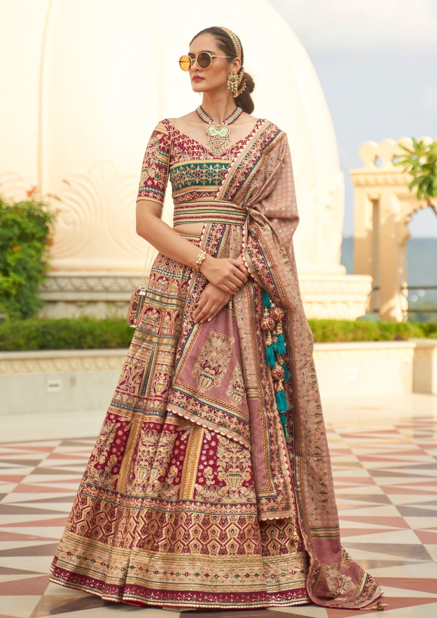 bride in red and green lehenga choli with dupatta