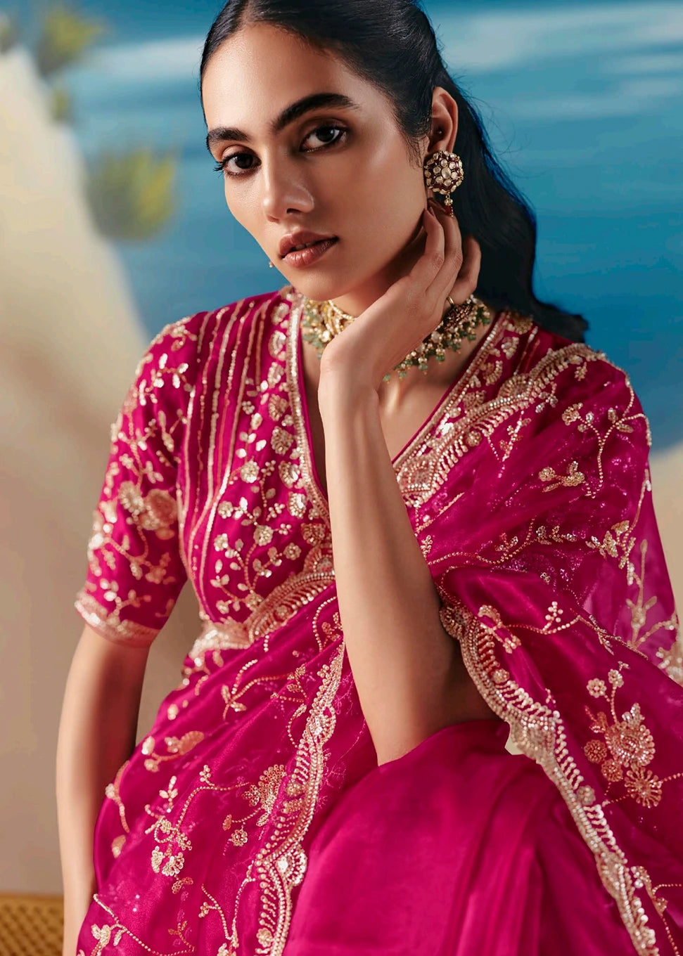 Vibrant pinkish red hand embroidered organza tissue saree with bead and sequin detailing for bridal reception and wedding function.