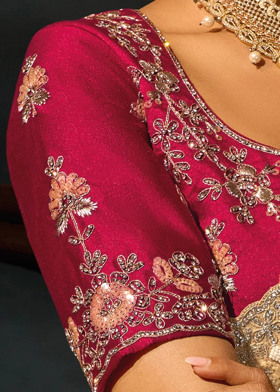 High-resolution close-up of a designer red kanjivaram bridal blouse featuring three-dimensional hand-embroidery, detailed floral sequins, stonework, faceted crystals, and dense bugle beadwork patterns.