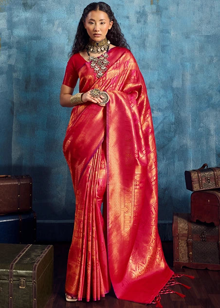 Woman in a red kanjivaram silk handloom saree standing in a vintage look.
