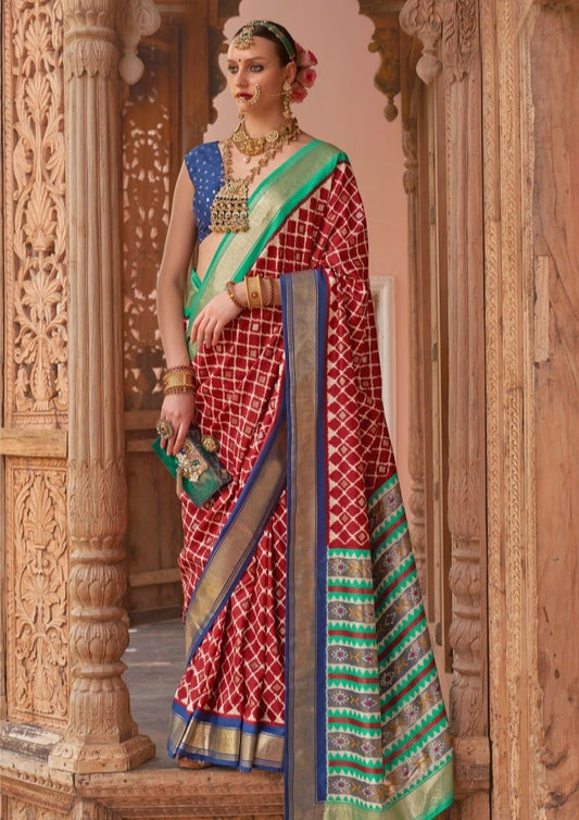 WOMAN IN RED PATOLA SAREE