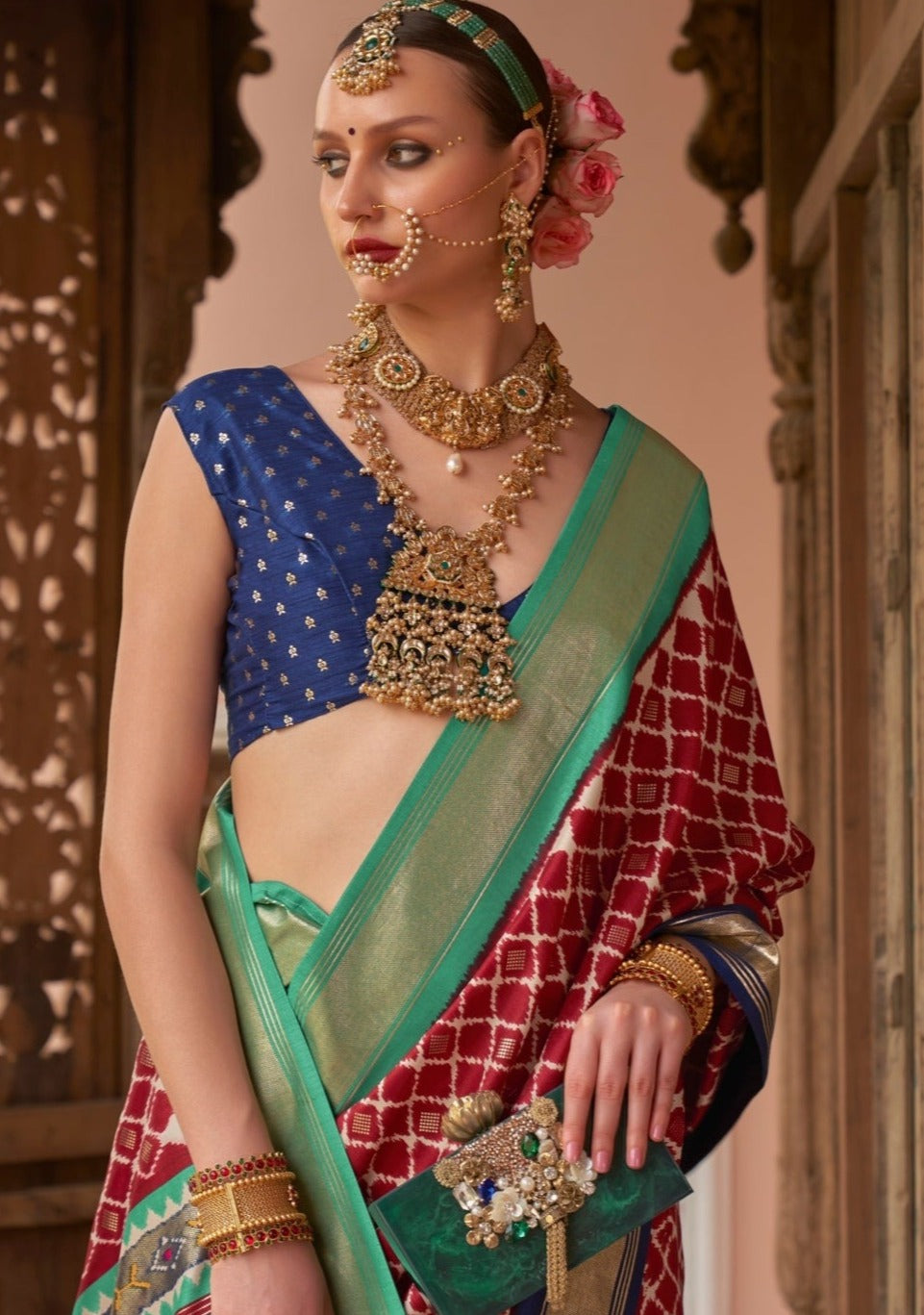 Woman in red patola saree & navy blue blouse online shopping price.