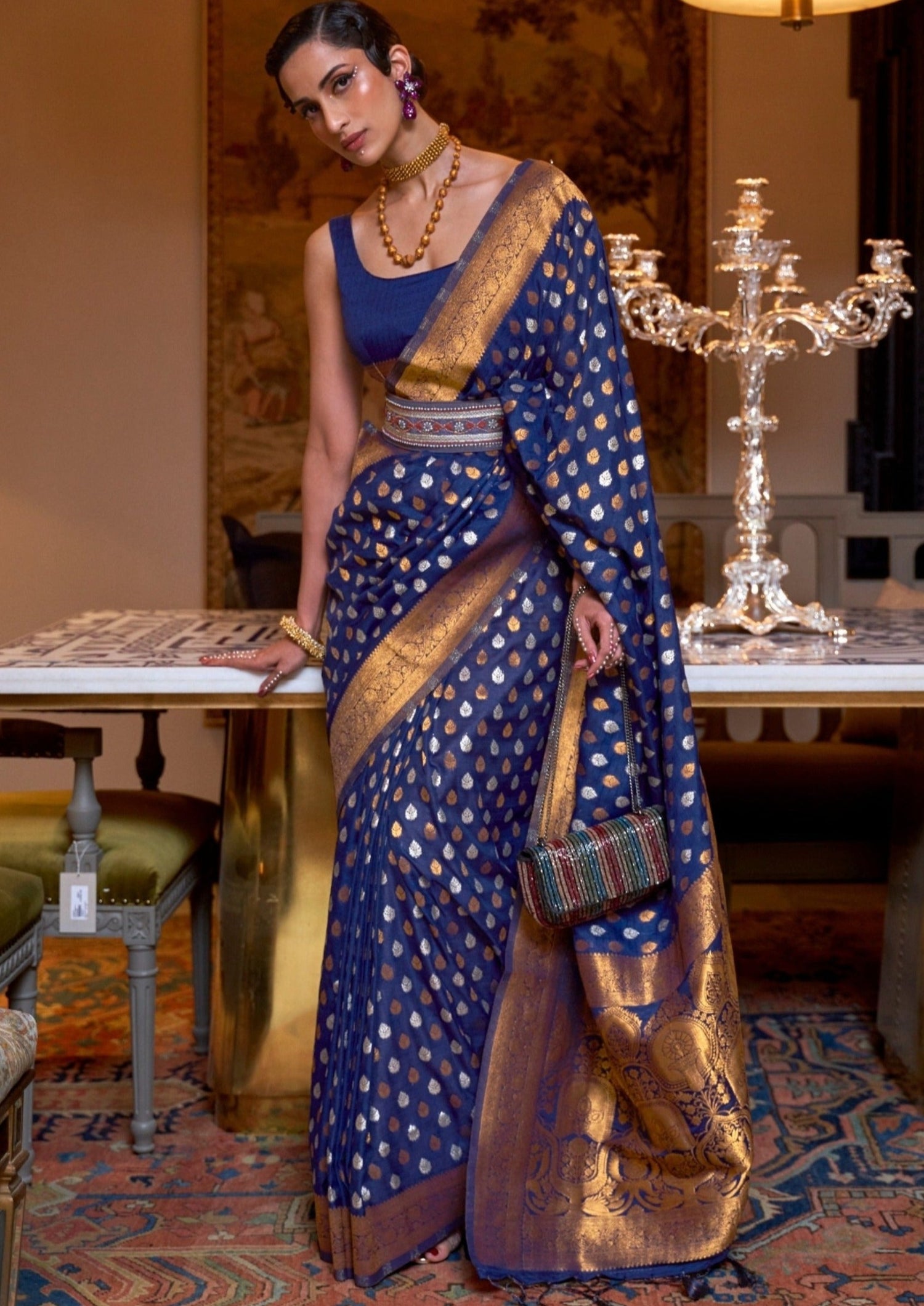 Woman in royal navy blue khaddi georgette banarasi saree blouse.